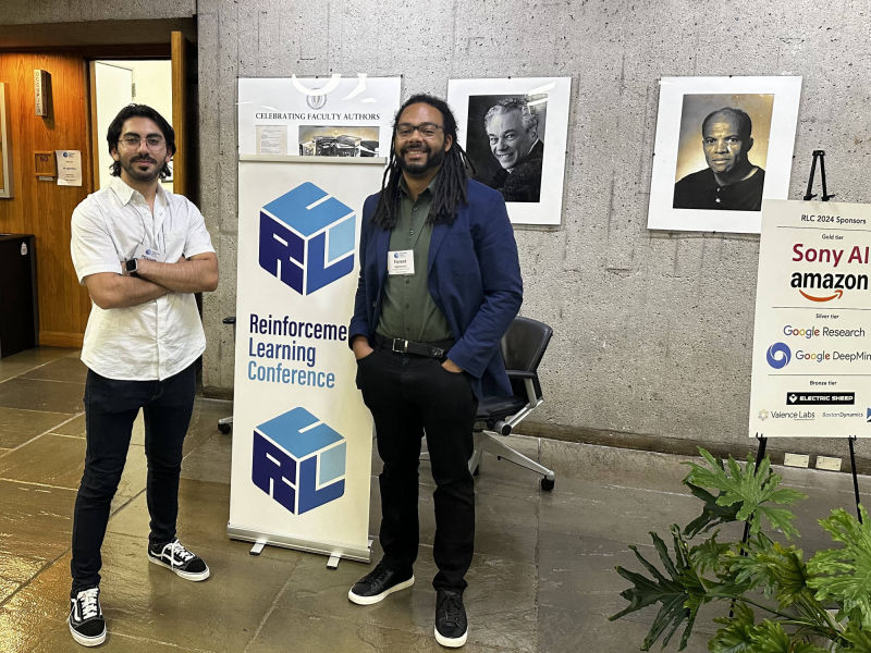 Misagh Soltani and Forest Agostinelli at the First Reinforcement Learning Conference 2024